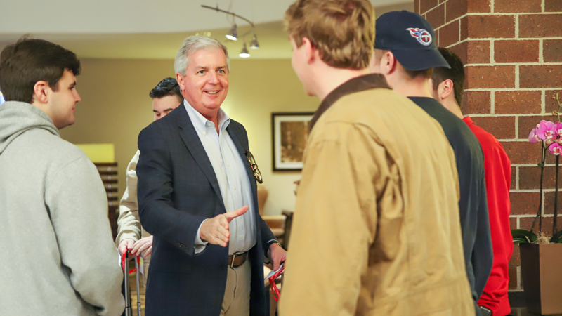 Indoor photo of gentlemen shaking hands